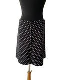 Jupe trapèze noire à pois blancs