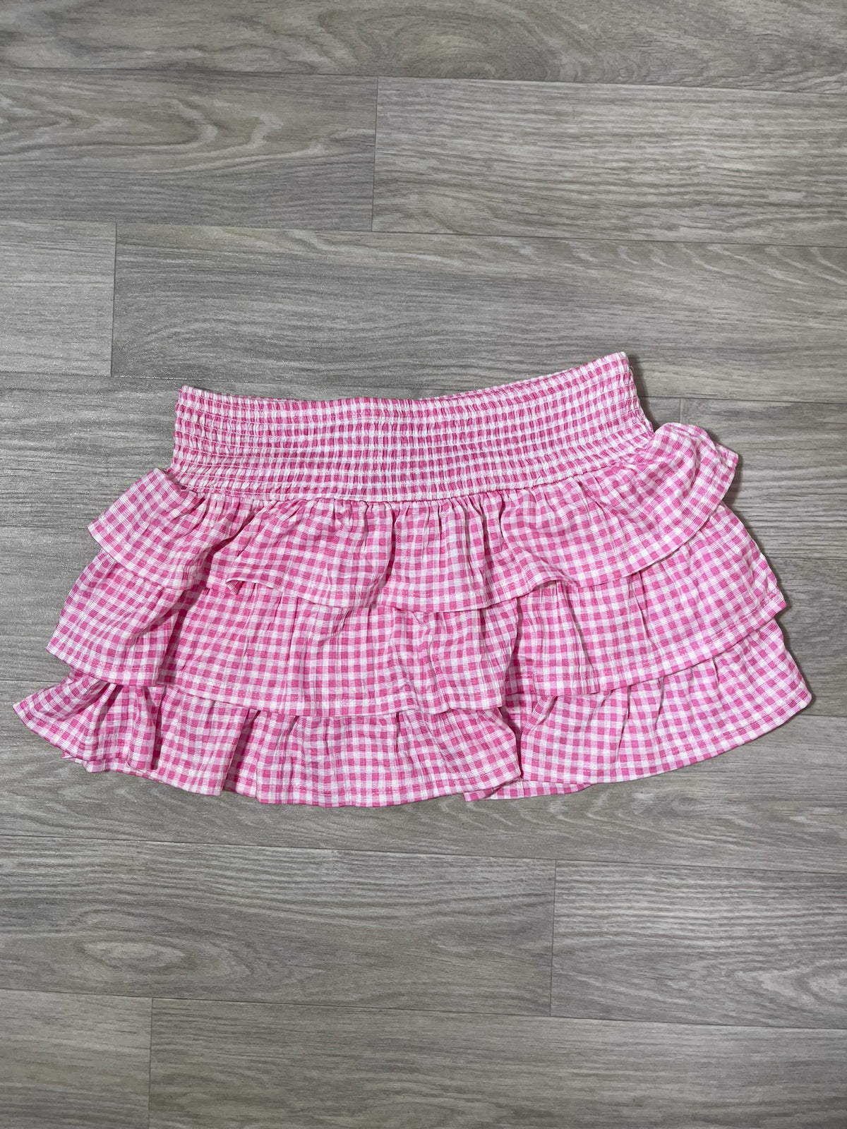 Jupe courte à carreaux vichy rose, volants étagés