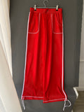 Pantalon large en mesh rouge à bandes blanches