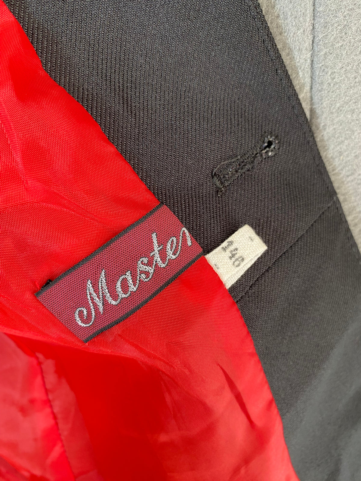 Veste d'équitation noire doublure rouge
