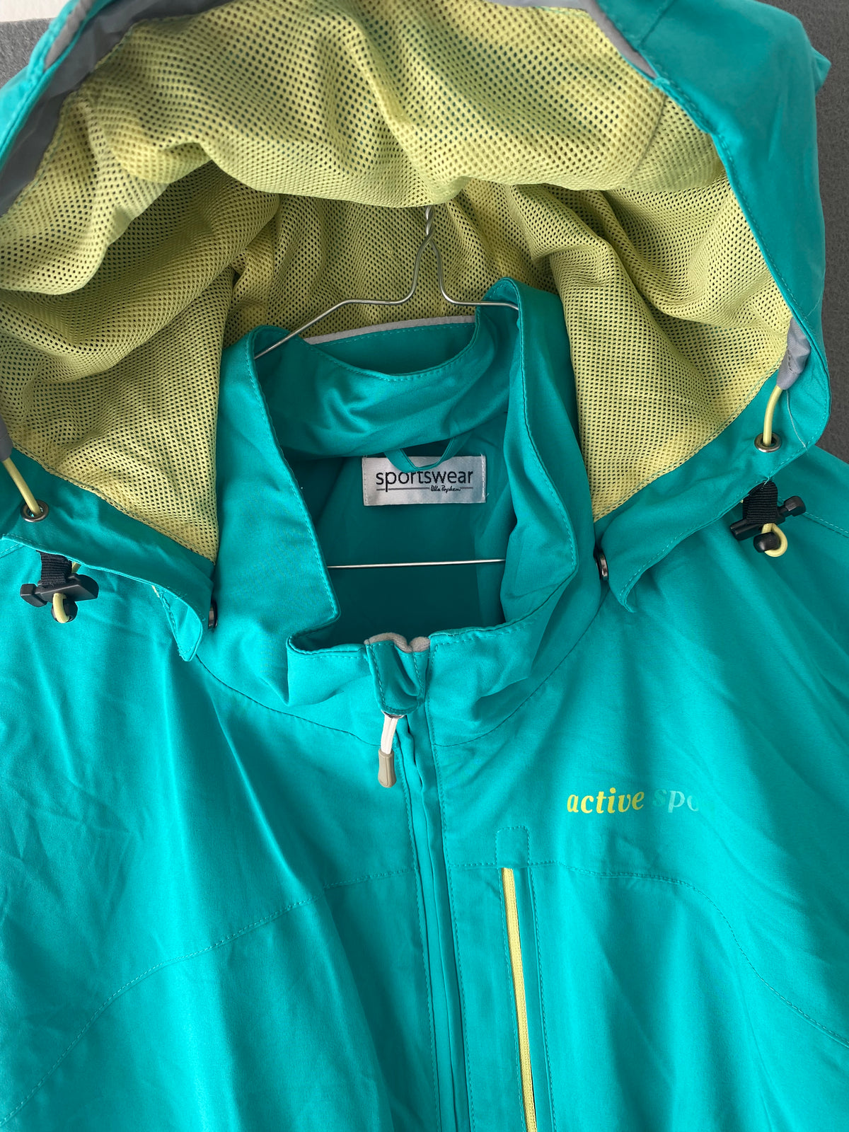 Veste coupe-vent sarcelle à capuche
