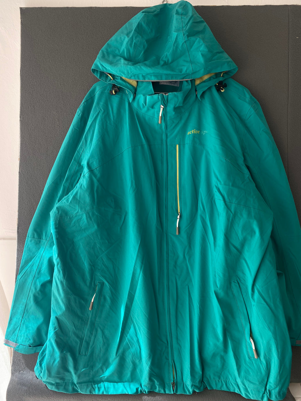 Veste coupe-vent sarcelle à capuche