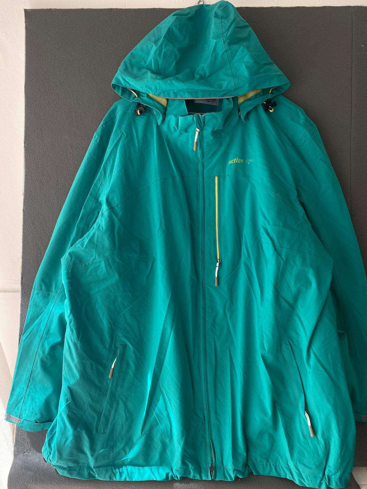 Veste coupe-vent sarcelle à capuche
