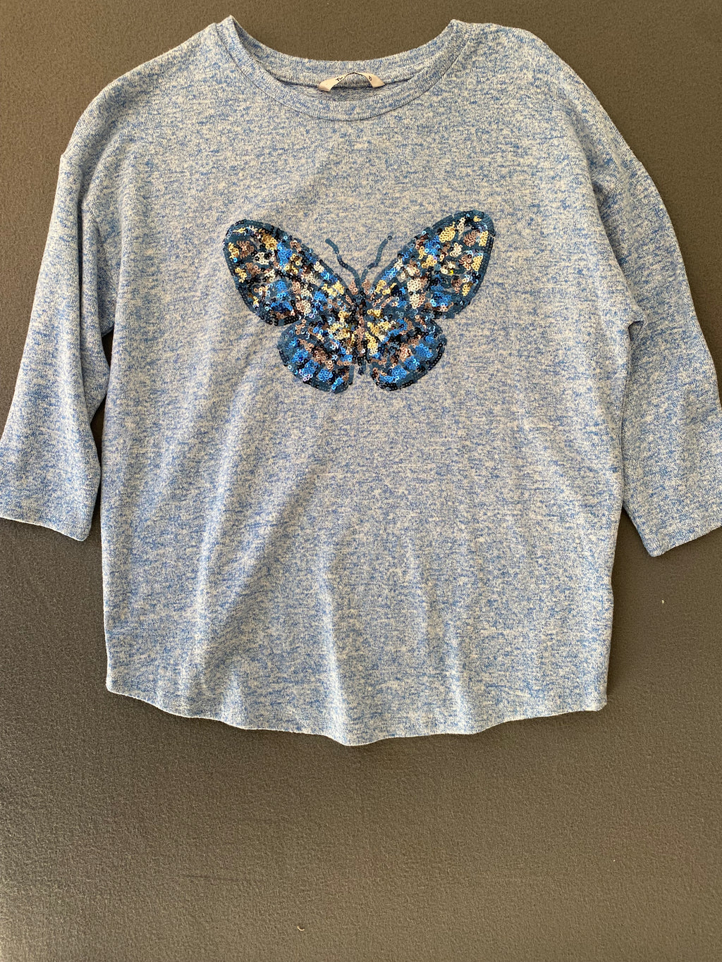 Pull bleu chiné papillon sequins