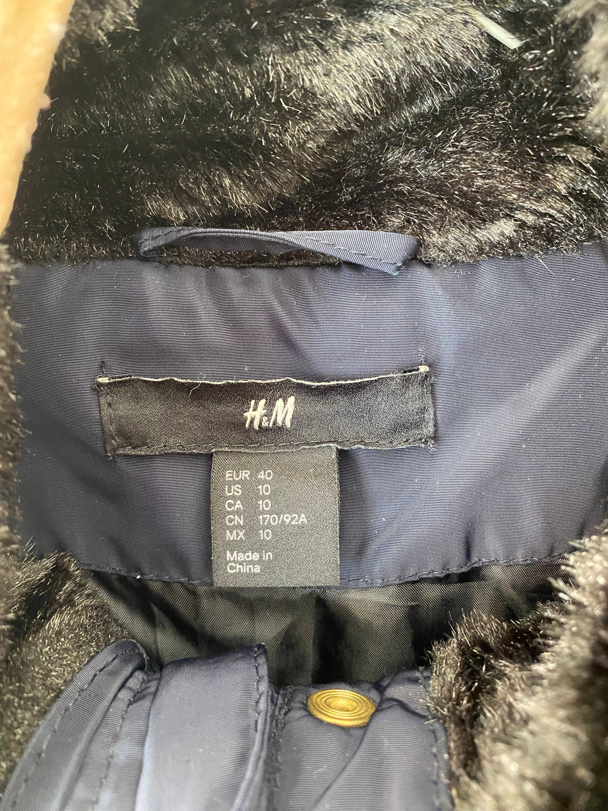 Veste matelassée bleu marine à liserés camel