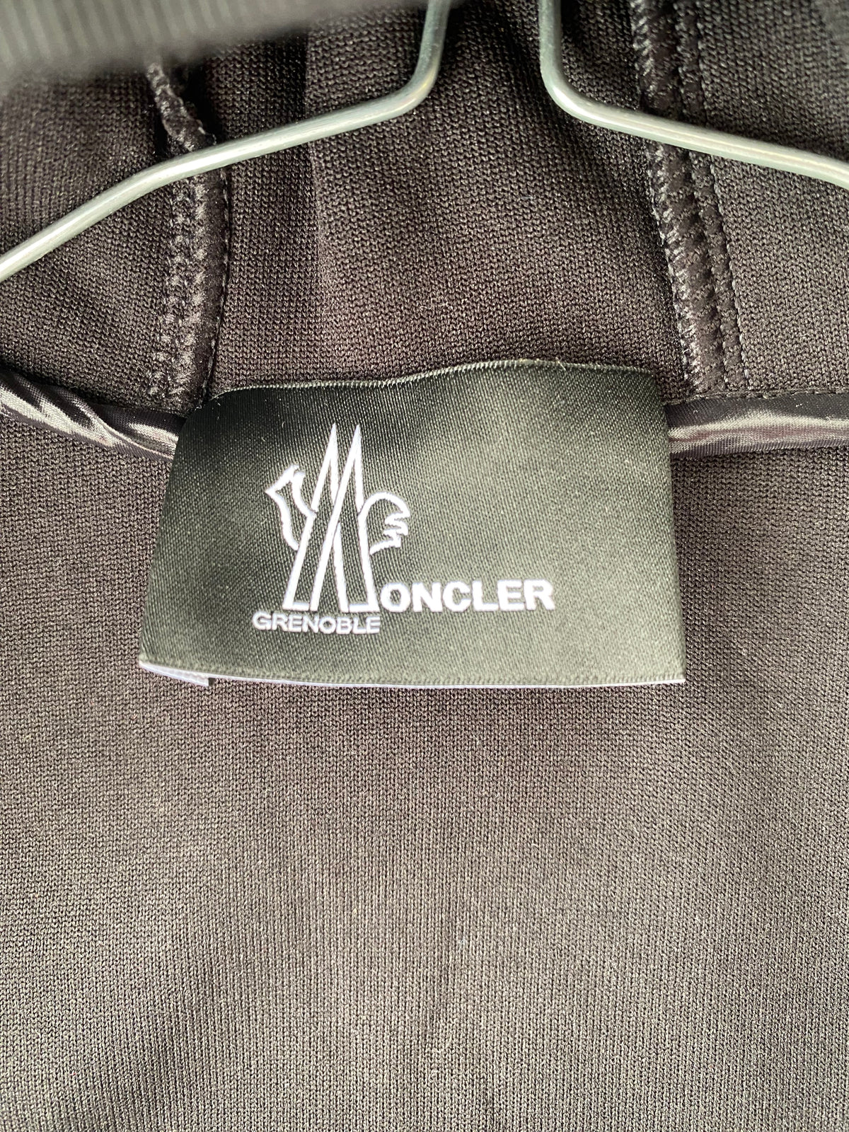 Veste polaire noire à capuche bi-matière