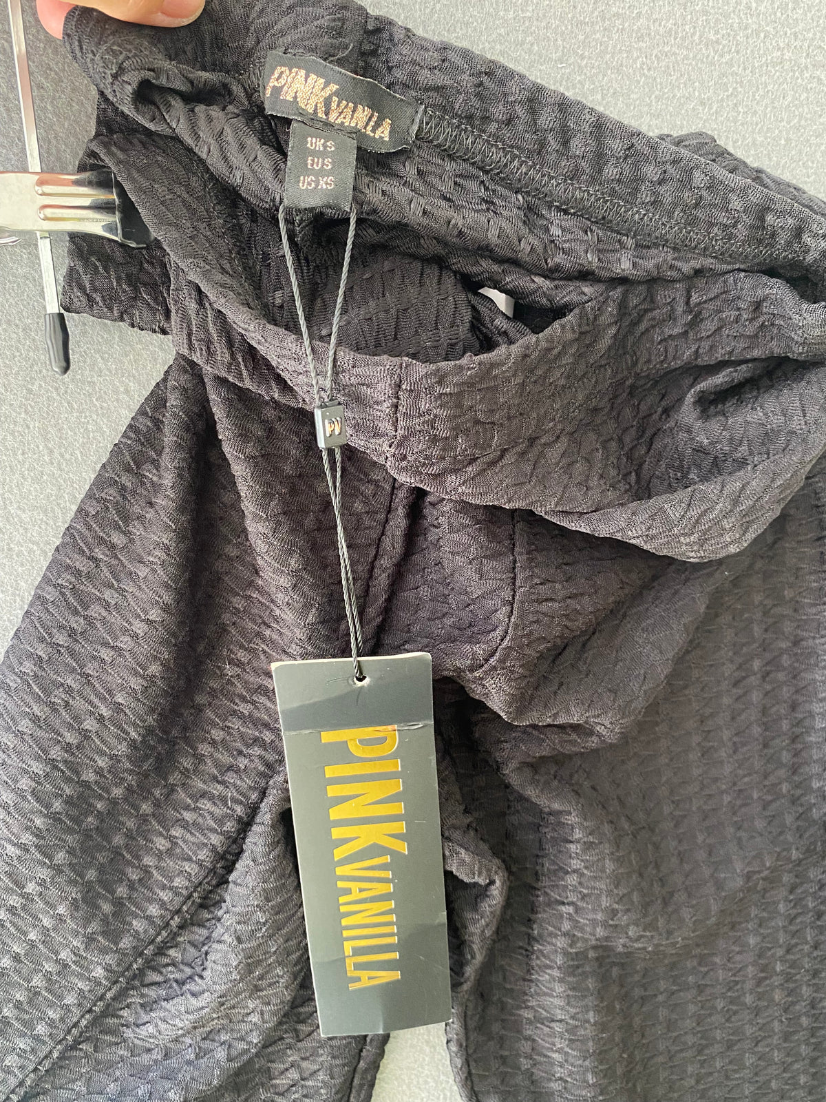 Pantalon évasé noir en maille texturée