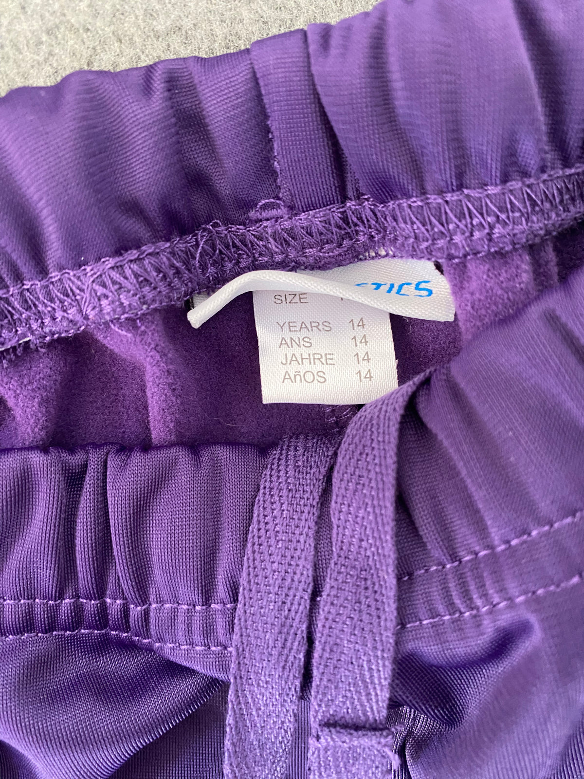Pantalon de survêtement violet passepoil rose