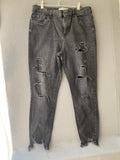Jean skinny noir destroy à bas effiloché
