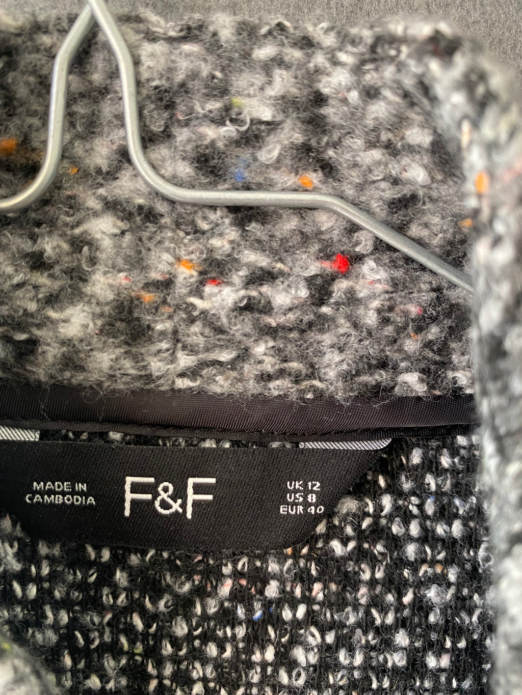 Manteau en bouclette gris moucheté