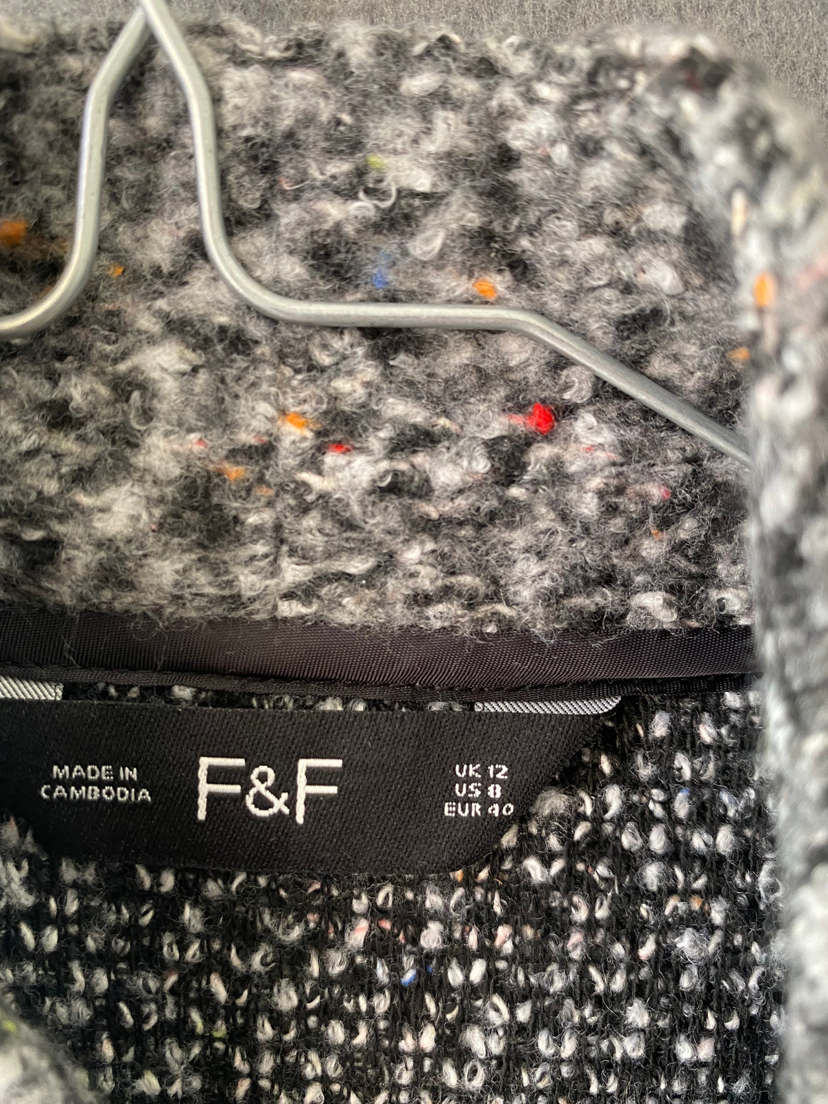 Manteau en bouclette gris moucheté