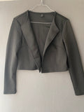 Veste courte noire ouverte à col revers