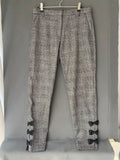 Pantalon à carreaux gris avec nœuds aux chevilles