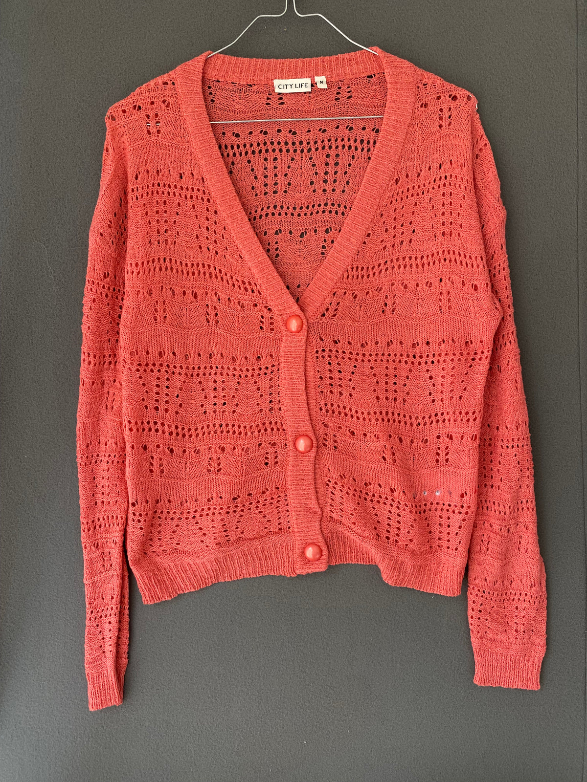 Gilet ajouré corail à col V