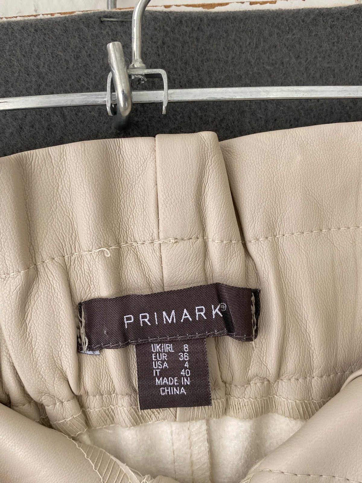 Pantalon en simili cuir écru taille paperbag